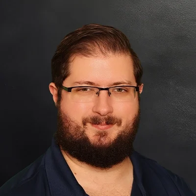 Massage Therapist Alexander Gorski Smiling In Collared Shirt