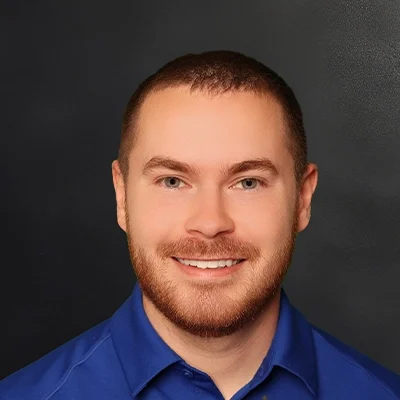 Physical Therapist Nathan Mohr Smiling In Blue Shirt